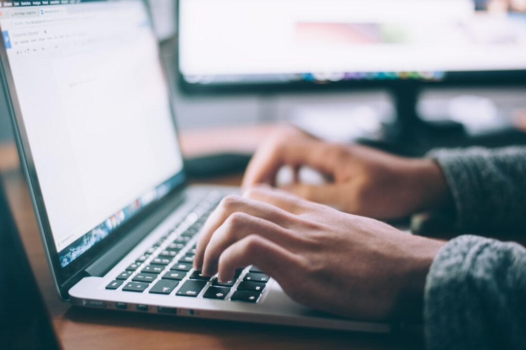 Man working on his website's SEO on laptop.