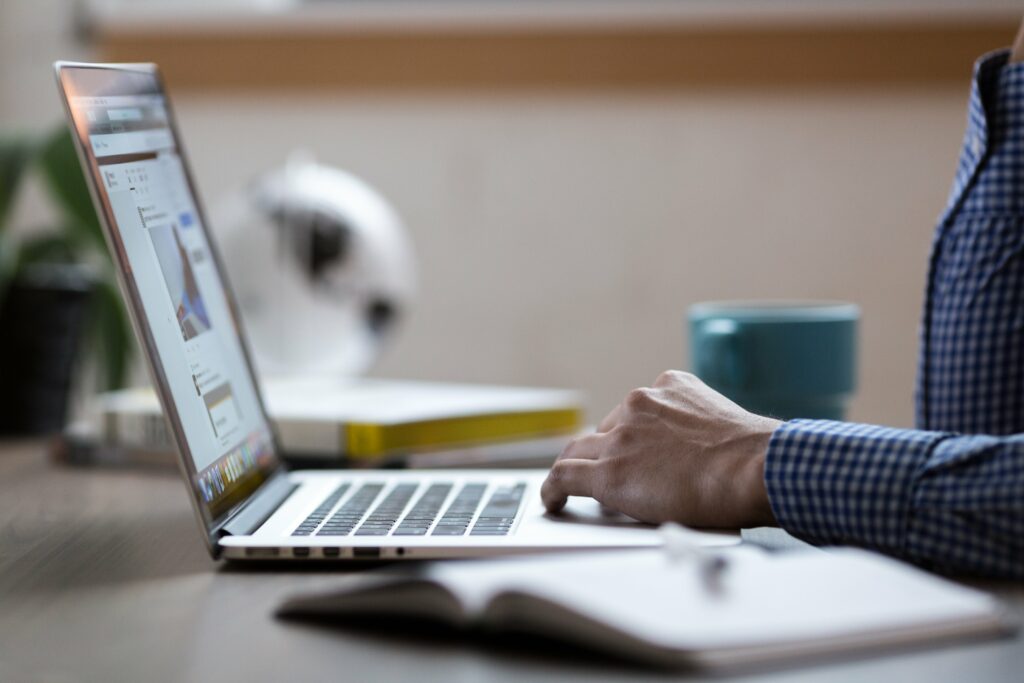 Person working on building backlinks on his laptop for a website.